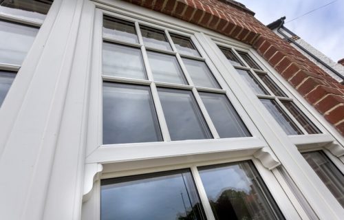 Close up of a white uPVC vertical sliding window